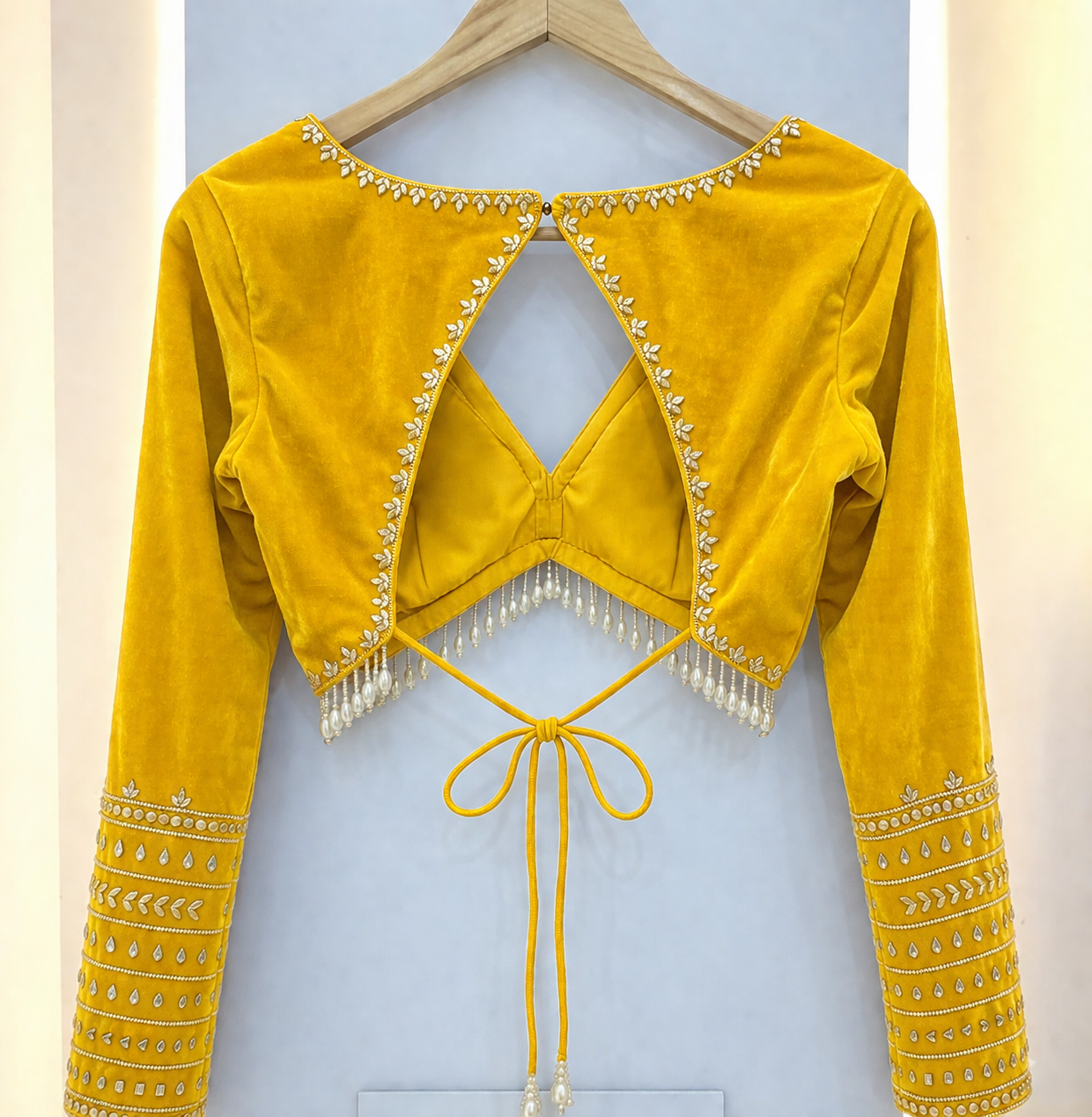 Elegant Shiny Yellow Velvet Backless Designer Blouse with Pearl Tassels