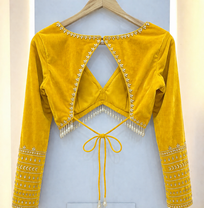 Elegant Shiny Yellow Velvet Backless Designer Blouse with Pearl Tassels