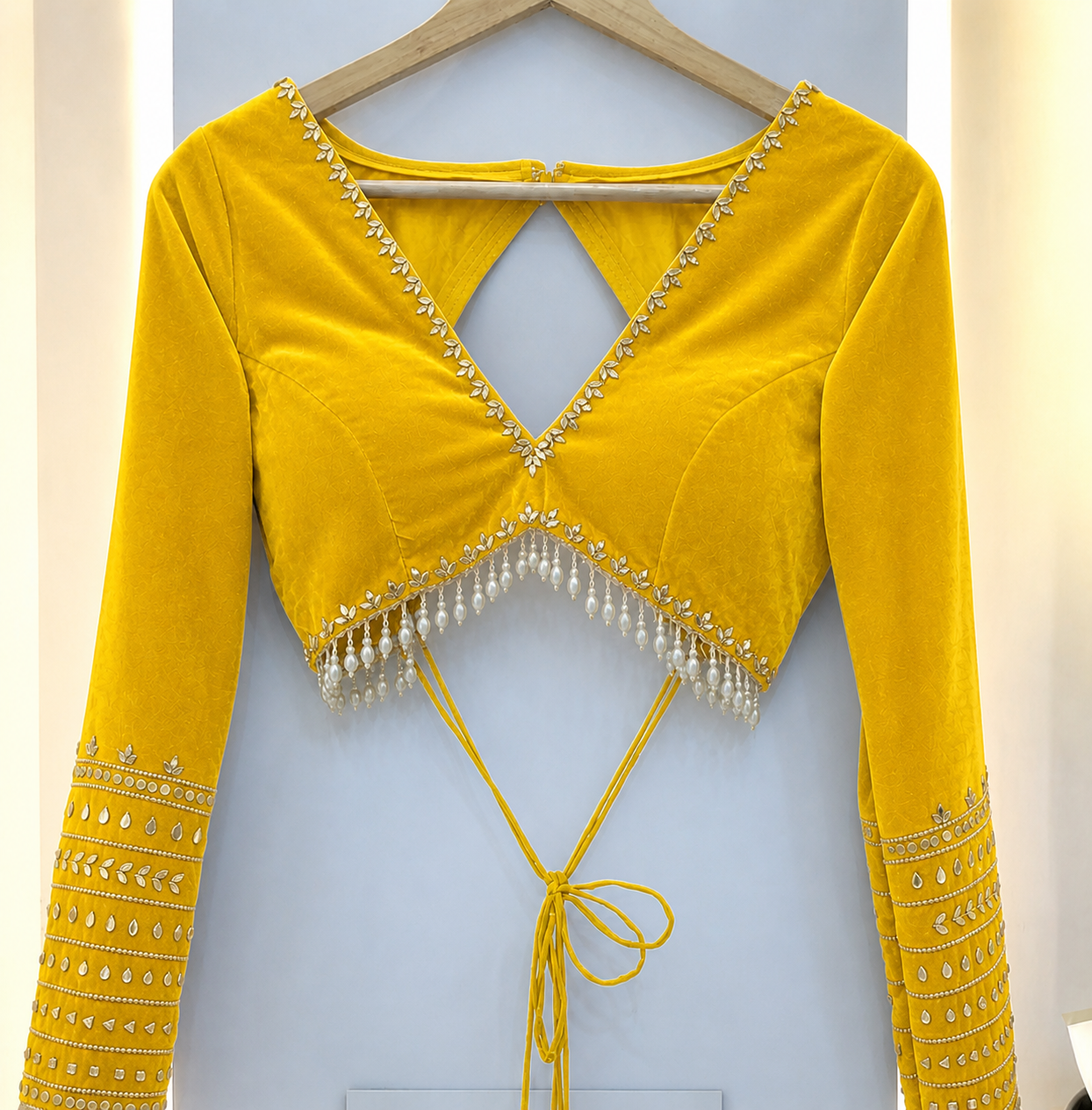Elegant Shiny Yellow Velvet Backless Designer Blouse with Pearl Tassels